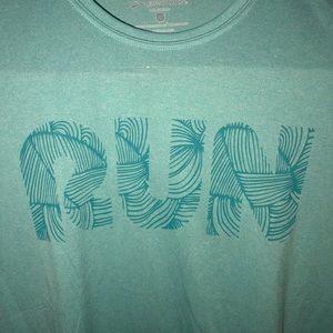 Never worn women’s Tiffany’s blue Brooks tech top